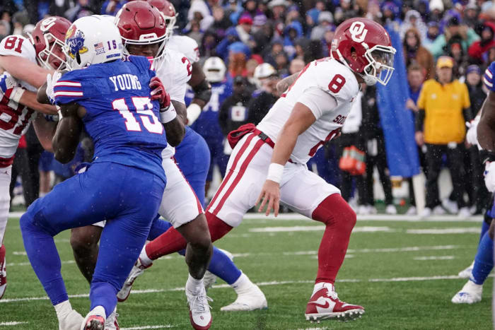 Oklahoma Sooners quarterback Dillon Gabriel runs against the Kansas Jayhawks.
